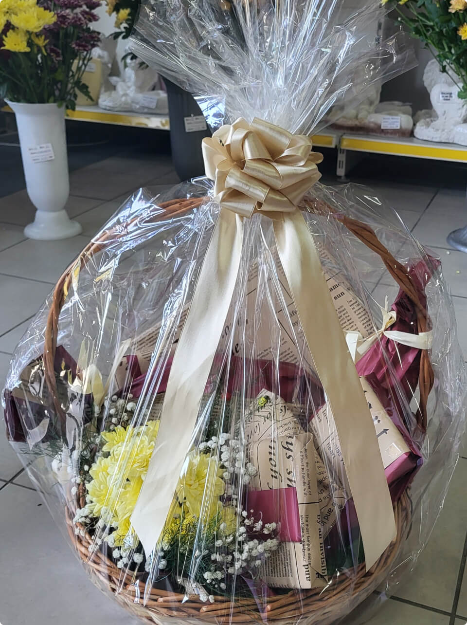 wrapped-gift-and-flowers-in-basket